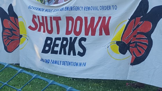 [Image description: A banner with two butterflies reads: "Governor Wolf, Issue an Emergency Removal Order to SHUT DOWN BERKS and end family detention in PA"]